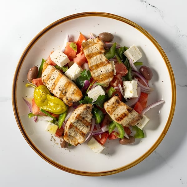 Djonisi’s Greek salad with grilled chicken, feta, olives, peppers, tomatoes, and red onion.